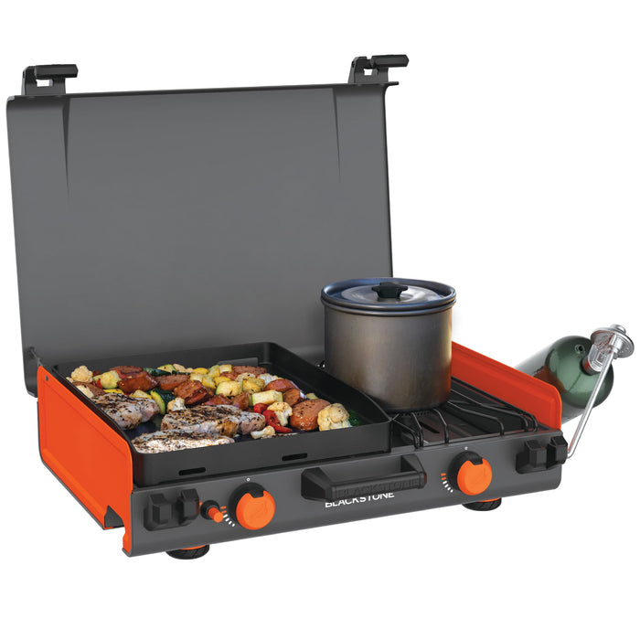 Blackstone 12x14" Camping Griddle and Side Burner For Outdoor Adventures

Pack your Griddle in the car and enjoy delicious meals wherever you end up. Built with a protective hood, latches, a handle, and a stow-and-go rear grease cup, this griddle packs up like a briefcase that is easy to carry with you. A 280 sq. in. Griddle and side burner with 14,400 combined BTUs make it easy to cook up your favorite griddle foods with the added versatility of being able to heat water, sauce or soups