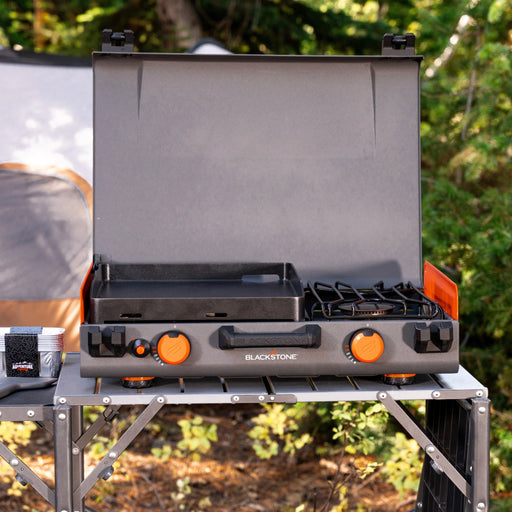 Blackstone 12x14" Camping Griddle and Side Burner For Outdoor Adventures

Pack your Griddle in the car and enjoy delicious meals wherever you end up. Built with a protective hood, latches, a handle, and a stow-and-go rear grease cup, this griddle packs up like a briefcase that is easy to carry with you. A 280 sq. in. Griddle and side burner with 14,400 combined BTUs make it easy to cook up your favorite griddle foods with the added versatility of being able to heat water, sauce or soups