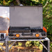 Blackstone 12x14" Camping Griddle and Side Burner For Outdoor Adventures

Pack your Griddle in the car and enjoy delicious meals wherever you end up. Built with a protective hood, latches, a handle, and a stow-and-go rear grease cup, this griddle packs up like a briefcase that is easy to carry with you. A 280 sq. in. Griddle and side burner with 14,400 combined BTUs make it easy to cook up your favorite griddle foods with the added versatility of being able to heat water, sauce or soups