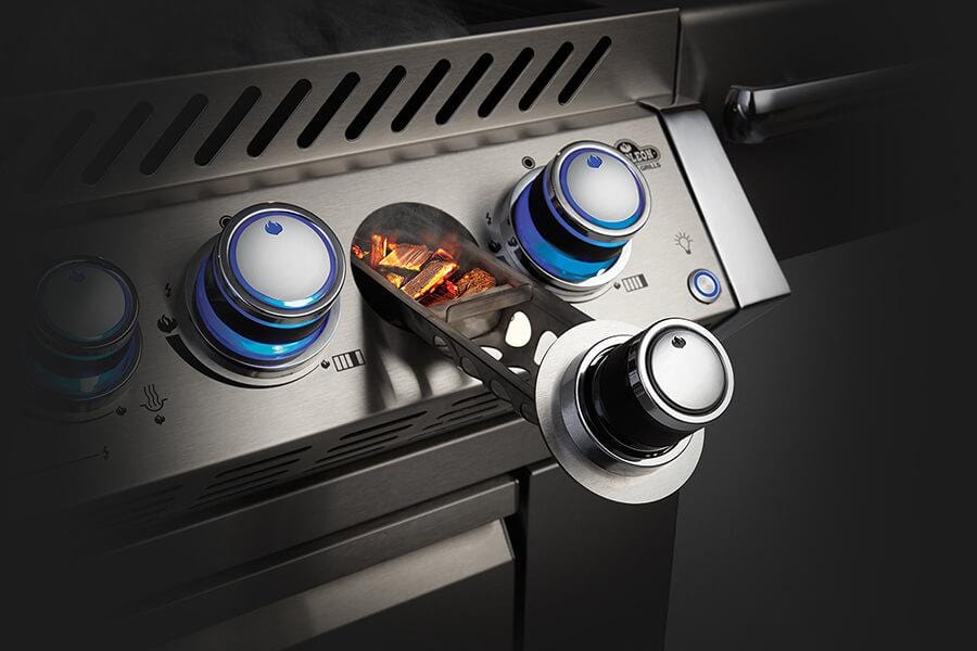 Napoleon's Prestige PRO™ 825 Natural Gas Grill with a Power Side Burner and Infrared Rear and Bottom Burners proves that two heads are better than one. On the outside, a shining stainless steel body provides durability against the elements while chrome details add luxury. The LED Spectrum NIGHT LIGHT™ Control Knobs have near limitless color options making night-time entertaining a breeze; they also glow red when the gas is left on as a safety feature.