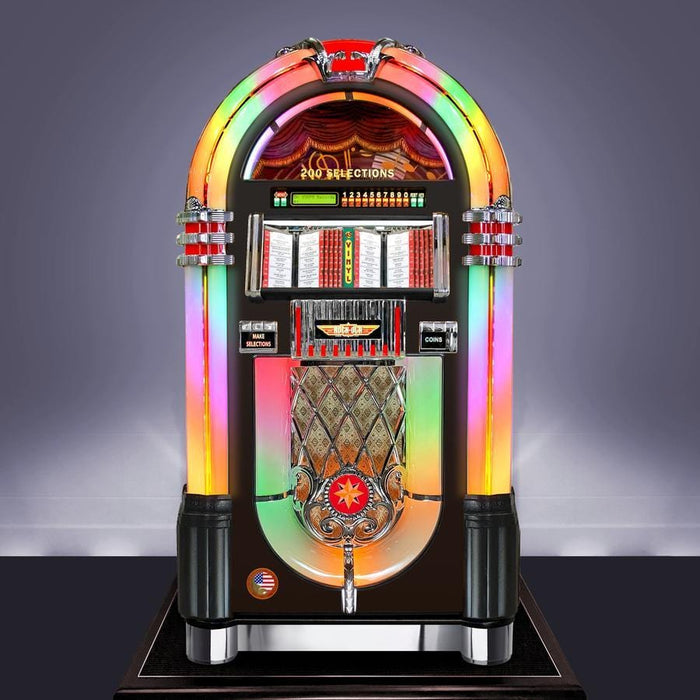 Experience the authentic American craftsmanship of the Rock-Ola Hand Built Bubbler Vinyl 45 in Gloss Black (RB8E-GB). This iconic jukebox plays 100 vinyl records, offers Bluetooth streaming, and combines the timeless design of the Wurlitzer 1015 with mesmerizing bubble tubes. Enjoy superior sound and enchanting visuals in this robust hand-built masterpiece.