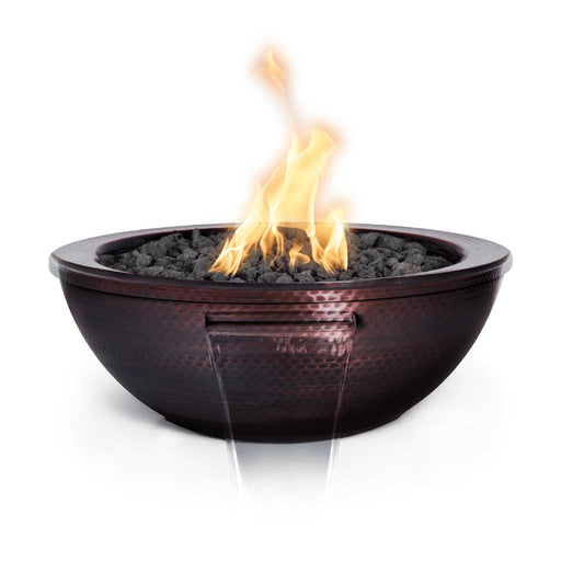 The Outdoor Plus 27" Sedona Fire and Water Bowl - Hammered Copper Specifications Ignition Type: Match Lit 12V Electronic Size: 27" 27" Height: 10" 10" Base: 12" 12" Burner: 8" 8" Scupper: 8" 8" Fuel Type: Natural Gas or Liquid Propane Natural Gas or Liquid Propane Maximum Heat Output: 45,000 BTUs 45,000 BTUs Gallons Per Minute: 7-10 (GPM) 7-10 (GPM)
