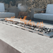 Elementi Granville Rectangular Concrete Outdoor Fire Pit Table OFG121. This magnificent rectangular fire table measures 60” by 27” by 17”. Its careful design includes a 30" long fire pit ring burner that can hold about 13.2 pounds of lava rocks. The entire fixture weighs 175 pounds, which ensures that it's stable enough to not tip over. The concrete fire table can produce dazzling dancing flames that dance about 18 to 26 inches high. The flames can raise the temperature to a maximum of 45,000 BTUs